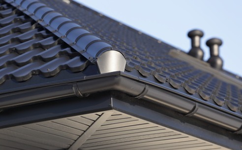 New black gutters on a house for Best Gutters in Bloomington IL